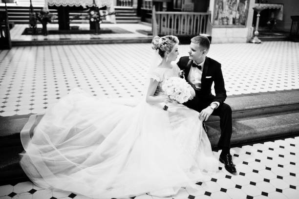 istock Wedding couple at catholic church 662882906
