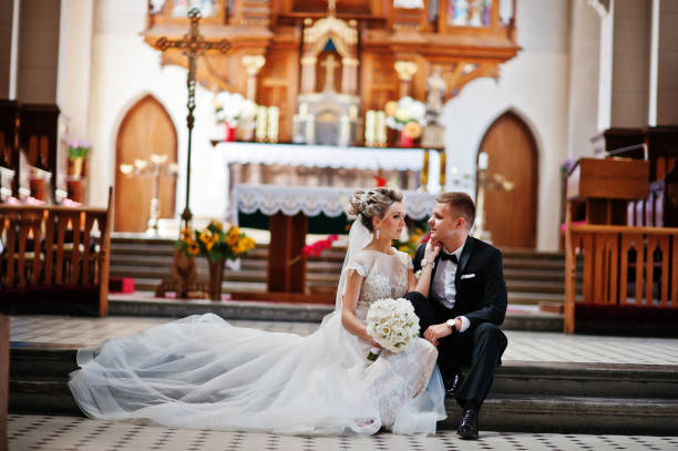 istock Wedding couple at catholic church 662882978