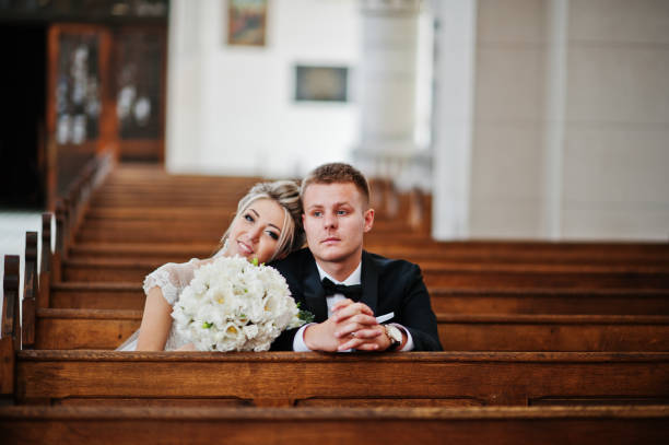istock Wedding couple at catholic church 662883652