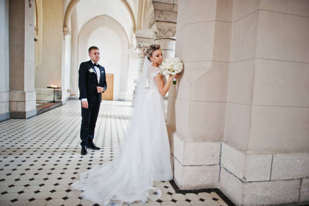 istock Wedding couple at catholic church 662883828