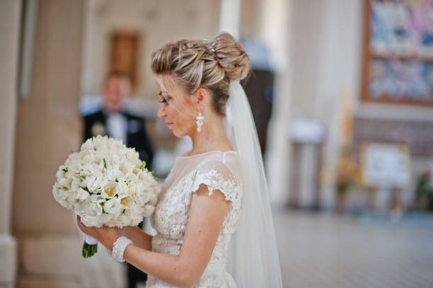 istock Wedding couple at catholic church 662883942