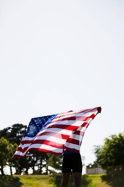 istock Athlete holding an american flag 662893700