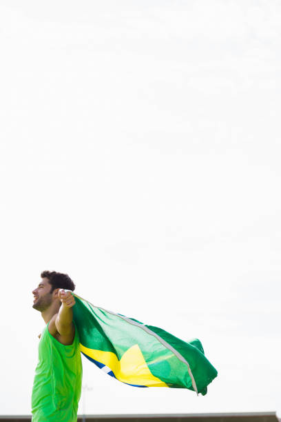 istock Athlete posing with brazilian flag after victory 662905950