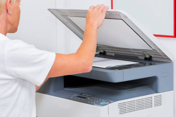 istock Nurse at work...using photocopier,copiing medical results 662913850