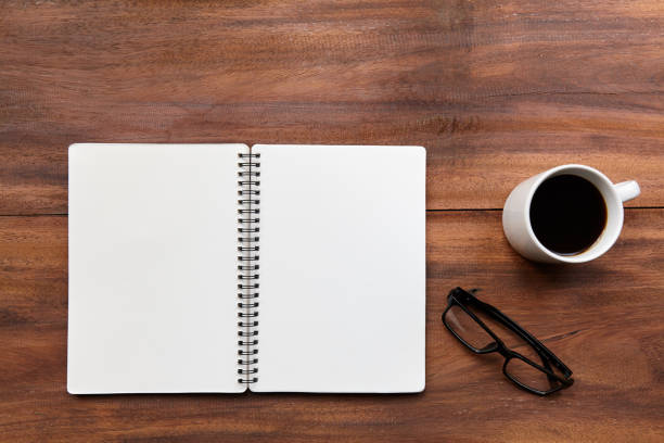 istock Blank note book and glasses with a black coffee 662918274