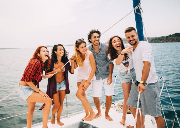 istock Happy friends on a yacht 662926364