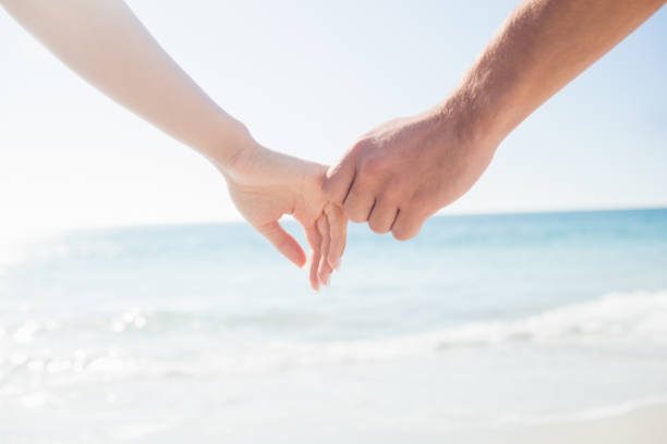 istock happy  couple holding hands 662949124