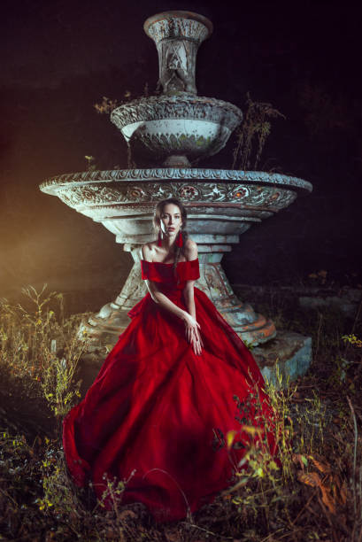 istock Beautiful lady near the fountain 662954046