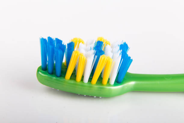 istock Closeup of toothbrush with uneven round tip bristle 662966616