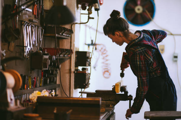 istock Pretty Young Woman Drilling Plank 662983084