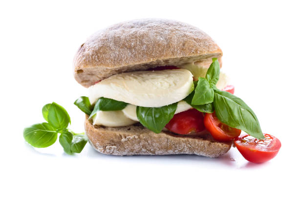 istock Ciabatta with mozzarella, tomato and basil isolated on white 663013318