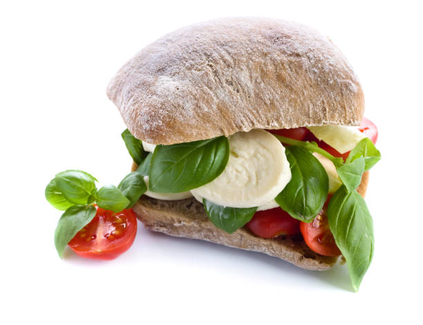 istock Ciabatta with mozzarella, tomato and basil isolated on white 663013712