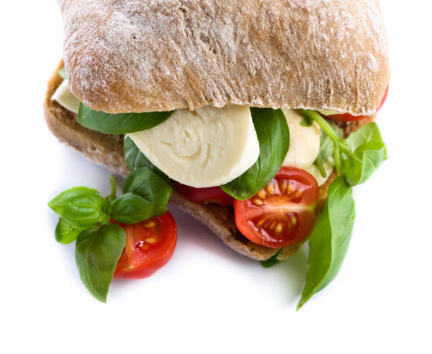 istock Ciabatta with mozzarella, tomato and basil isolated on white 663014412