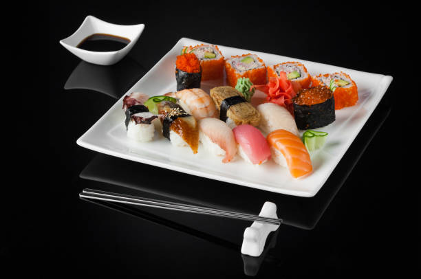 istock sushi in a plate on a black background 663032042