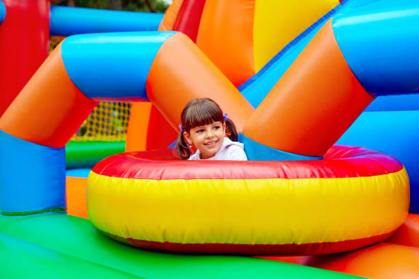 istock happy kid, having fun on inflatable attraction playground 663042656