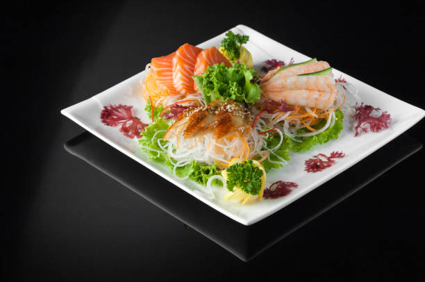 istock sushi in a plate on a black background 663044834
