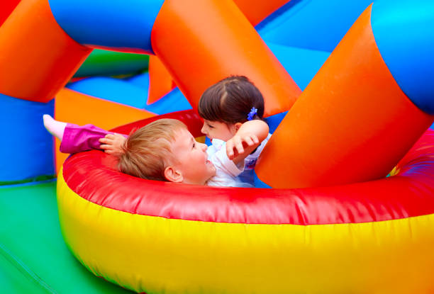 istock excited kids having fun on inflatable attraction playground 663052884