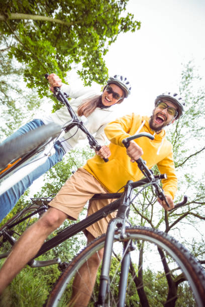 istock Happy couple on mountain bikes 663064784