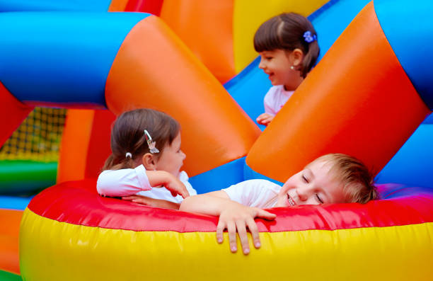 istock excited kids having fun on inflatable attraction playground 663066162