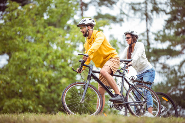 istock Happy couple on a bike ride 663066276