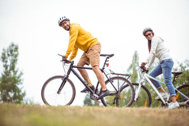 istock Happy couple on a bike ride 663072010