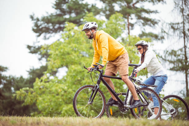 istock Happy couple on a bike ride 663072448
