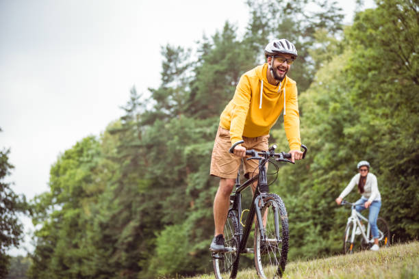 istock Happy couple on a bike ride 663073276