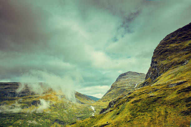 istock Mountain misty autumn landscape with dramatic cloudy sky Norway 663073688