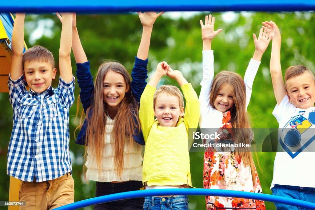 happy excited kids having fun together on playground Child Stock Photo