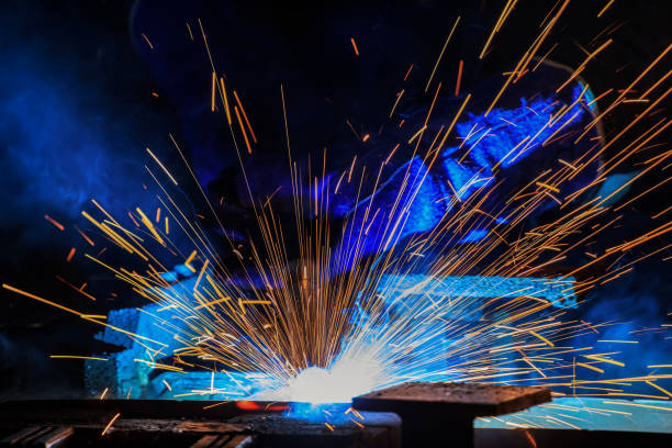 istock Lighting from worker welding steel in factory 663075352