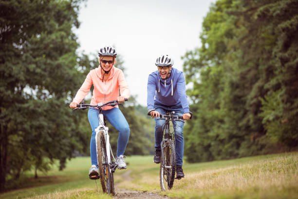istock Happy couple on a bike ride 663084502