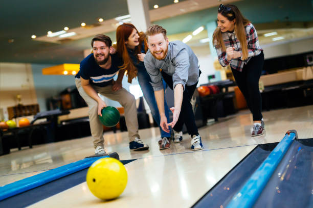 istock Friends bowling at club and having fun playing casually 663100654
