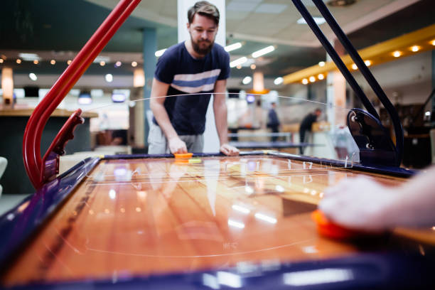 istock Air hockey game  is fun even for adults 663104158