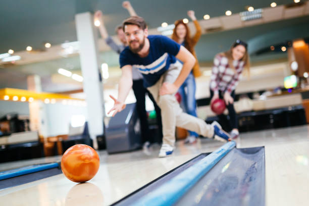 istock Friends bowling at club and having fun playing casually 663104600
