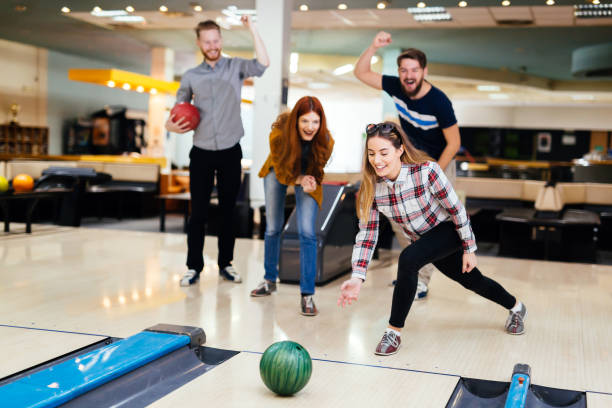 istock Friends bowling at club and having fun playing casually 663104992
