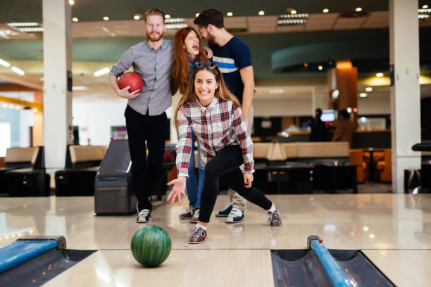 istock Friends bowling at club and having fun playing casually 663105012