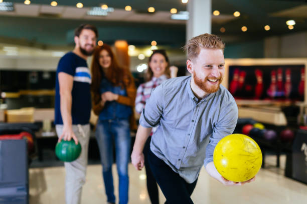 istock Friends bowling at club and having fun playing casually 663105646