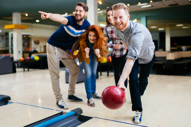 istock Friends bowling and enjoying moments together 663109082