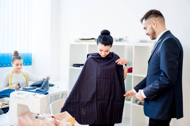 istock Young couple at tailor shop 663123814