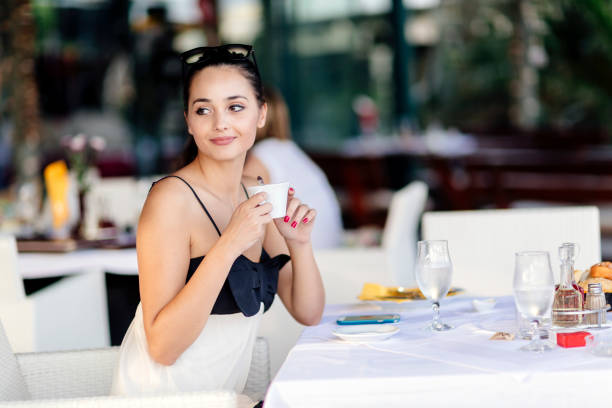 istock Beautiful young women drinking tea in restaurant 663125706