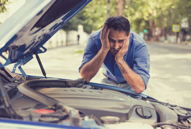 istock young stressed man having trouble with his broken car 663162034