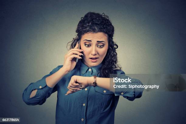 Stressed Businesswoman Looking At Wrist Watch Stock Photo - Download Image Now - Adult, Adults Only, Beautiful People