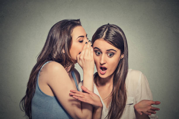 istock Girl whispering into woman ear 663190400