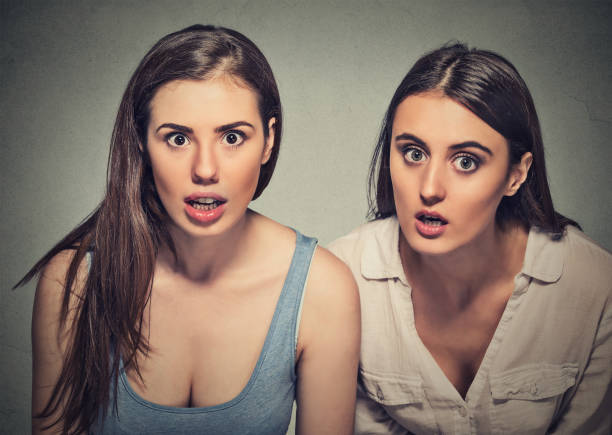 istock Two attractive young women surprised astonished 663190898