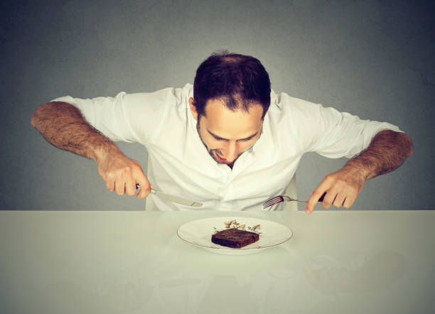 istock Hungry man craving sweet food pound cake 663198134