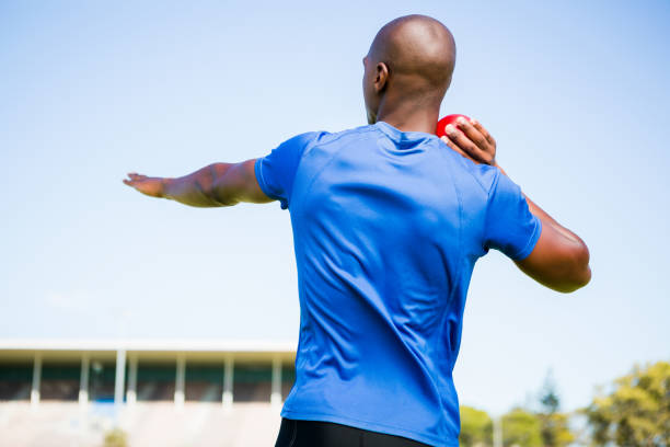 istock Male athlete preparing to throw shot put ball 663199898