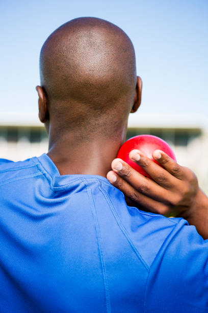 istock Male athlete preparing to throw shot put ball 663200334