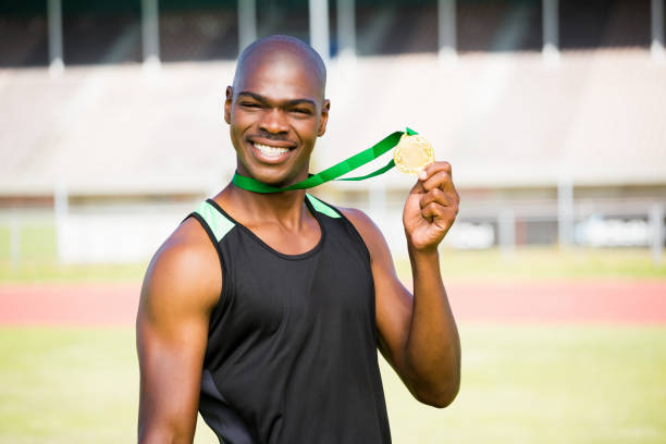 istock Athlete showing his gold medal 663211576