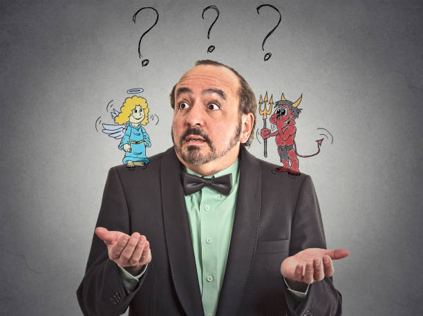 Confused man with angel and devil on his shoulders uncertain what choice to make