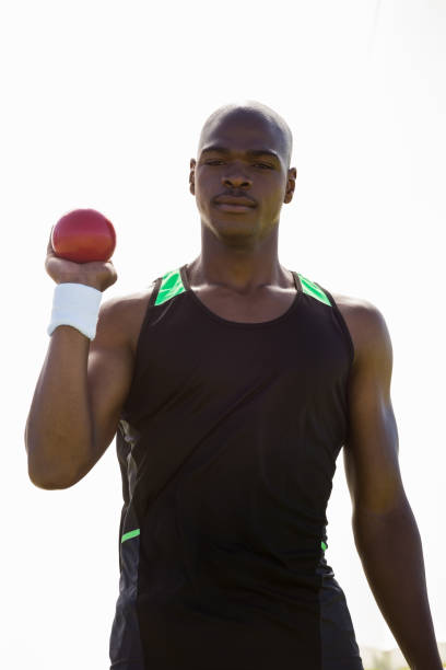 istock Male athlete holding shot put ball 663223308